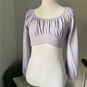 Lilac purple cropped blouse with long sleeves and tie closure
Size XS